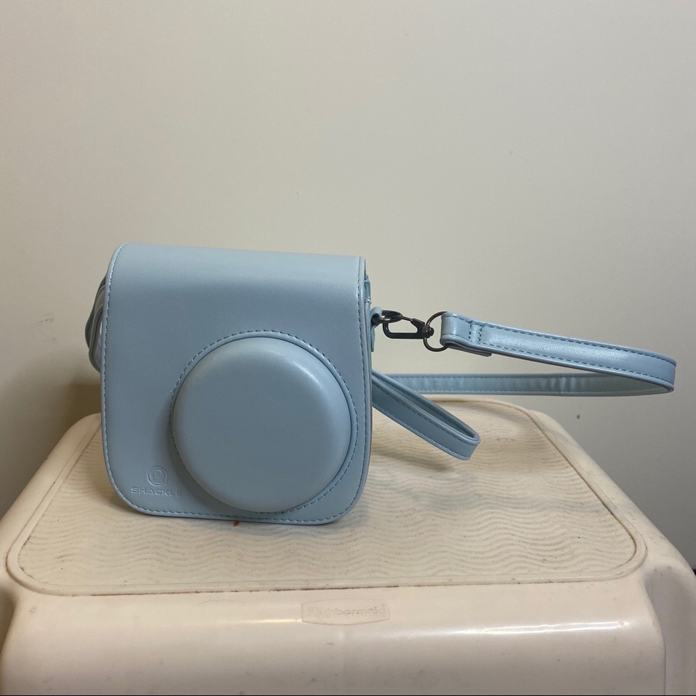 Light blue instax camera crossbody